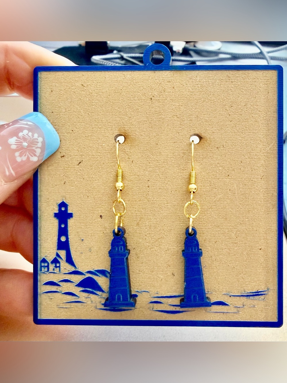 Hand crafted wood Lighthouse earrings on a wood matching card holder